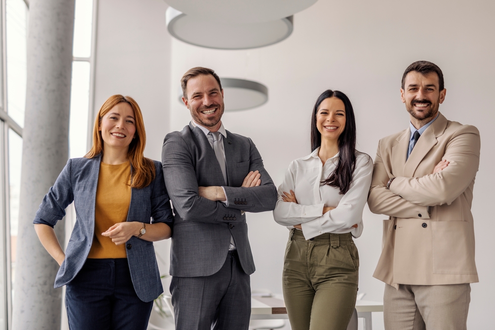 Confident leadership team standing at corporate offic